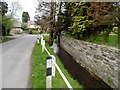 Drain running alongside road, Yarpole