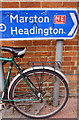 Cycle route sign and benchmark on University Parks South Lodge