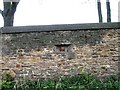 WWII gun point in stone wall