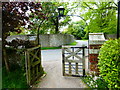 Looking past the church gates into Church Lane