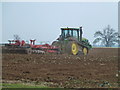 TF6809 : Tractor at work near Abbey Farm, Shouldham Warren by Richard Humphrey