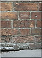 Benchmark on building at the south end of Newbold Road