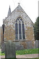 SK6617 : East end of All Saints Church and slate headstones by Roger Templeman