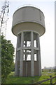 Water tower beside road south from Waltham on the Wolds