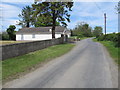 Carrickananny Road approaching its junction with minor road leading to Ballymoyer Road