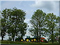 TL1296 : Tractors in transit on the A1 near Peterborough by Richard Humphrey