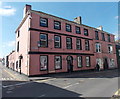 Pink building on the corner of Bridge Street and Station Road, Kidwelly