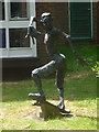 Wimborne Minster: skateboarder sculpture by the library