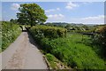 Country road and field gateway