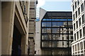 View of 10 Gresham Street with the large London Wall office block reflected