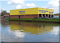 Yellow canalside building in Gloucester