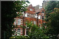 View of houses on Earls Court Square from Earls Court Square Garden