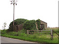 TG1014 : RAF building in field beside Honingham Lane by Evelyn Simak