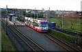 Midland Metro tram no. 09 leaving Bradley Lane tram stop, Bilston near Walsall