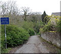 SN9804 : Cyclists dismount sign on the approach to a river footbridge, Llwydcoed by Jaggery