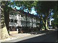 3-storey 20-century terrace N of Grovelands Close, Camberwell Grove, E side