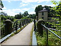 Footbridge over the River Goyt leads to Brabyns Park