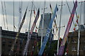 View of a colourful array of masts of the Round the World Clippers from St. Katharine