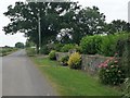 ST3015 : Floral display outside the garden of New House Farm by Christine Johnstone