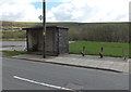 Bus shelter and the remains of a bench in Evanstown