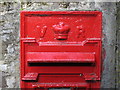 NY7756 : Victorian postbox near Whitfield Hall - royal cipher and aperture by Mike Quinn