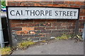 Street name sign and benchmark on #16 South Bar Street