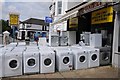 Washing machines outside a shop