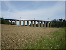 NU2311 : Arable field between the river and the railway by Graham Robson