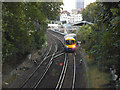 London Overground train leaving Kensington Olympia