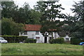 View of a house in Matching Green from the green #6