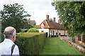 View of the cottages next to the church from the path leading to the windmill