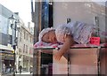 Sleeping baby doll in a Rotherham shop window