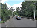 Car and trailer heading over The Bridge of Turret