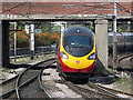 Pendolino train approaching Warrington Bank Quay