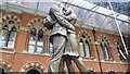 The Meeting Place statue in side St Pancras International railway station