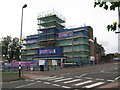 SP0795 : Shrouded in scaffolding still open - Kingstanding, North Birmingham by Martin Richard Phelan