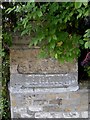 Old stone road sign