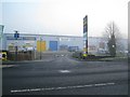 Foggy morning, south Leamington ? small retail sheds, Tachbrook Park Drive