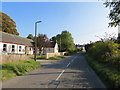 Road (B7068) and Village Hall at Bankshill