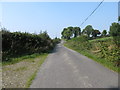 H8719 : Road westwards towards Tullyraghan Cross Roads by Eric Jones