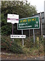 TM1159 : Roadsigns on Meadow Vale by Geographer