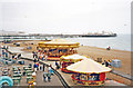 TQ3103 : Brighton, 2002: round-abouts on shore by Palace Pier by Ben Brooksbank