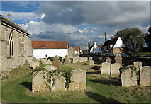 TL7190 : Gravestones at  St Mary's Church, Feltwell by Trevor Littlewood