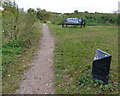 Bench and marker along the towpath