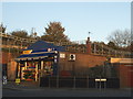 Shop and railway line on The Gardens, North Harrow