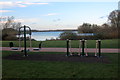 Exercise equipment by the lakeside path