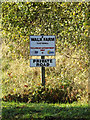 TM1888 : Walk Farm sign by Geographer
