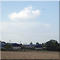 SP2079 : Farm buildings and field below the Birmingham Airport flightpath, Walsal End by Robin Stott