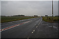 NS8491 : Looking east along the A905 at Fallin by Ian S
