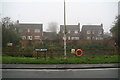 Houses overlooking the pond in Little Weighton